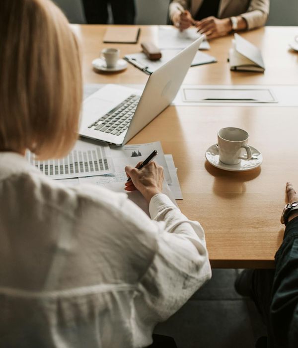 Business executives analyzing strategic financial reports during conference