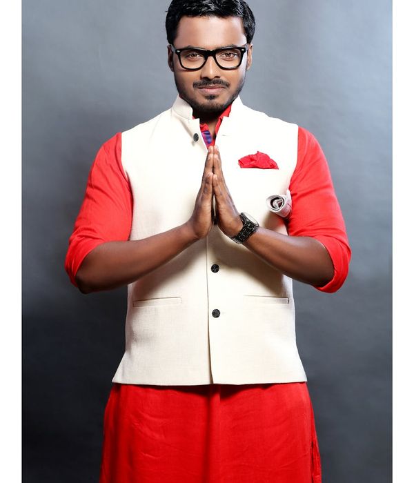 Man in contemporary professional clothing with approachable appearance