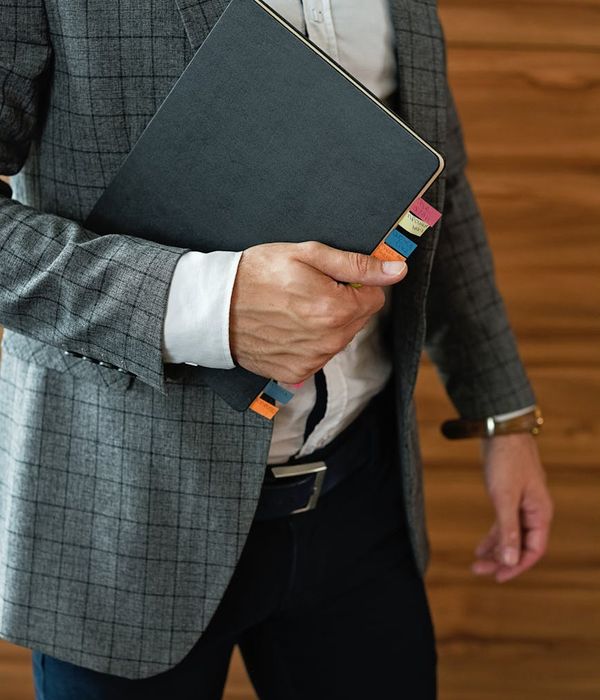 Man in corporate attire with confident business demeanor