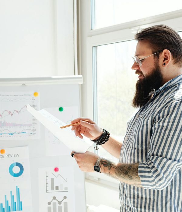 Professional auditors analyzing financial reports in contemporary workspace