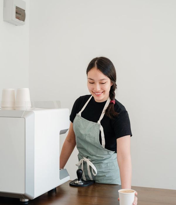 Woman professional in business clothing with welcoming smile